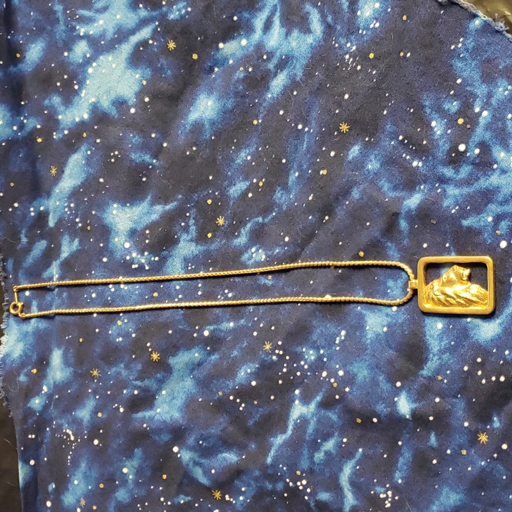 Gold tone lion head pendant